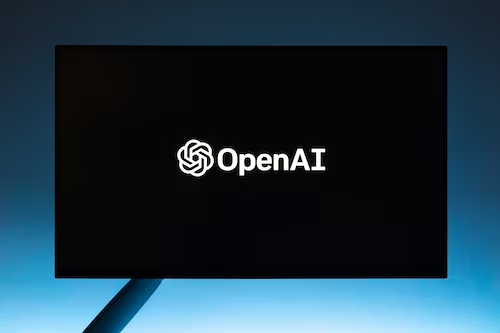Imagem com a logo da OpenAI representando o ChatGPT e a internet.